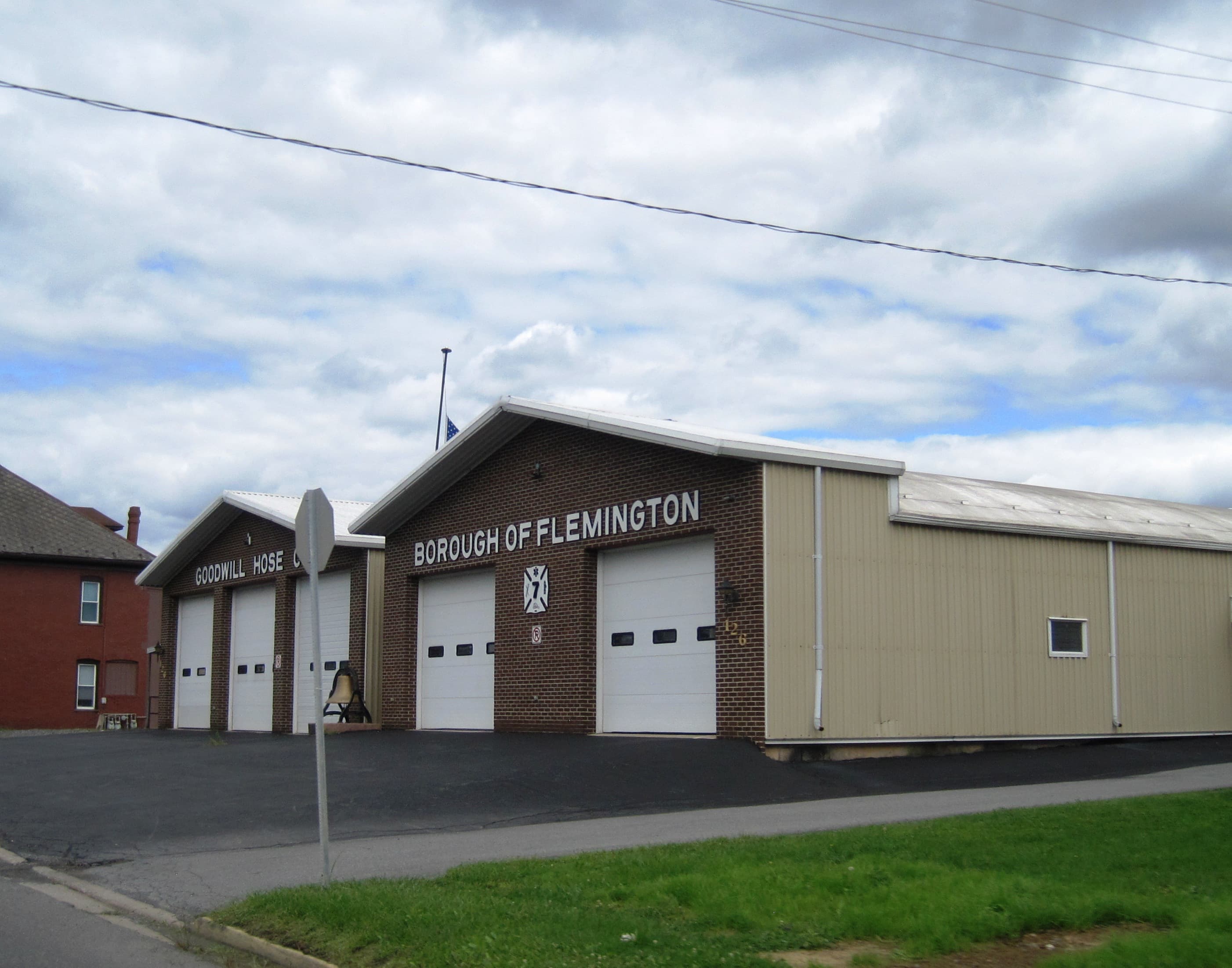 Flemington Borough Hall and the Goodwill Hose Company building in Flemington, Pennsylvania, on a summer day