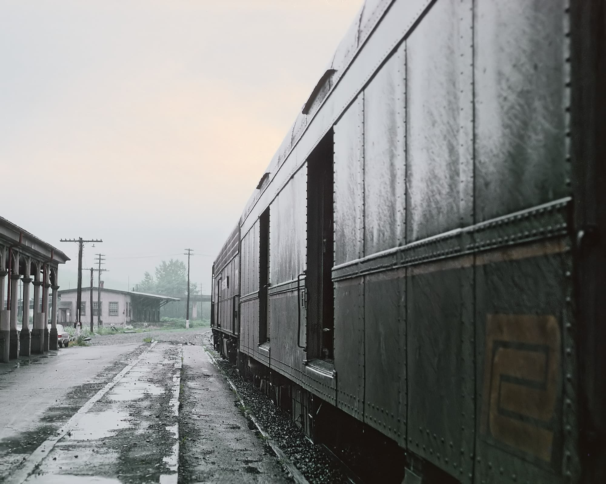 A passenger train, the Buffalo Day Express, stopped at the Renovo, Pennsylvania station in July 1969, showing the town's railroad past.