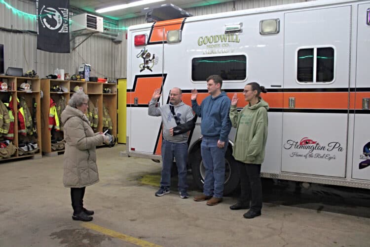 Flemington Mayor Jo LaRocque swears in Goodwill Hose Company officers Tony Mahon as deputy chief, Dustin Houtz as fire chief, and Maureen Mahon as assistant chief at the Flemington fire station.