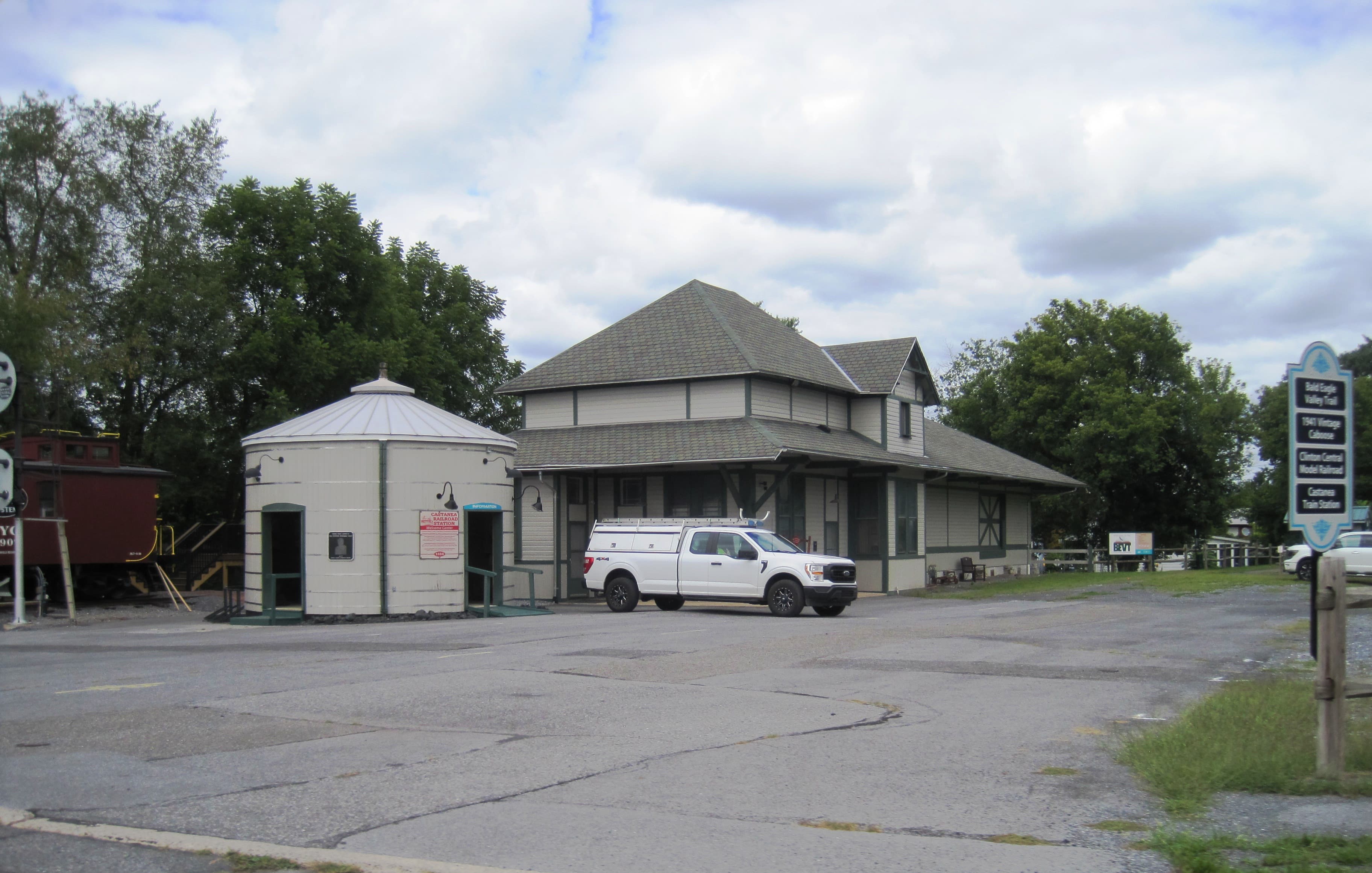 The 1883 former Castanea, Pennsylvania railroad station, a single-story Victorian building with wide eaves, viewed from Logan Avenue