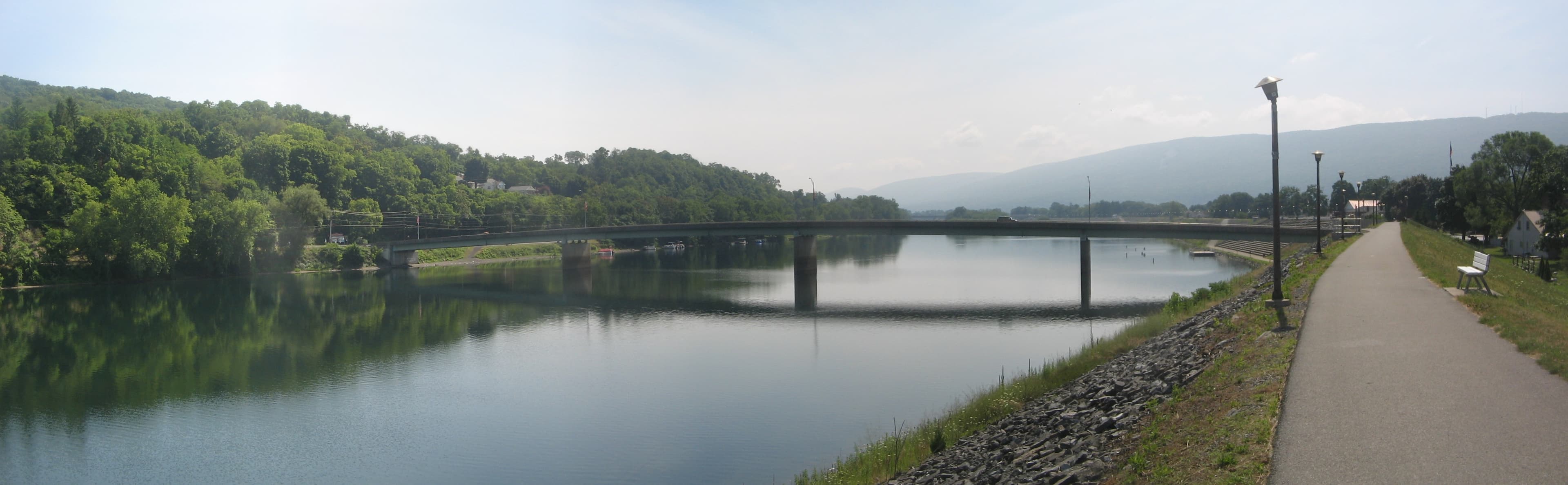 Panoramic view of the Veterans Bridge crossing the West Branch Susquehanna River at Lock Haven, with Bald Eagle Mountain in the background