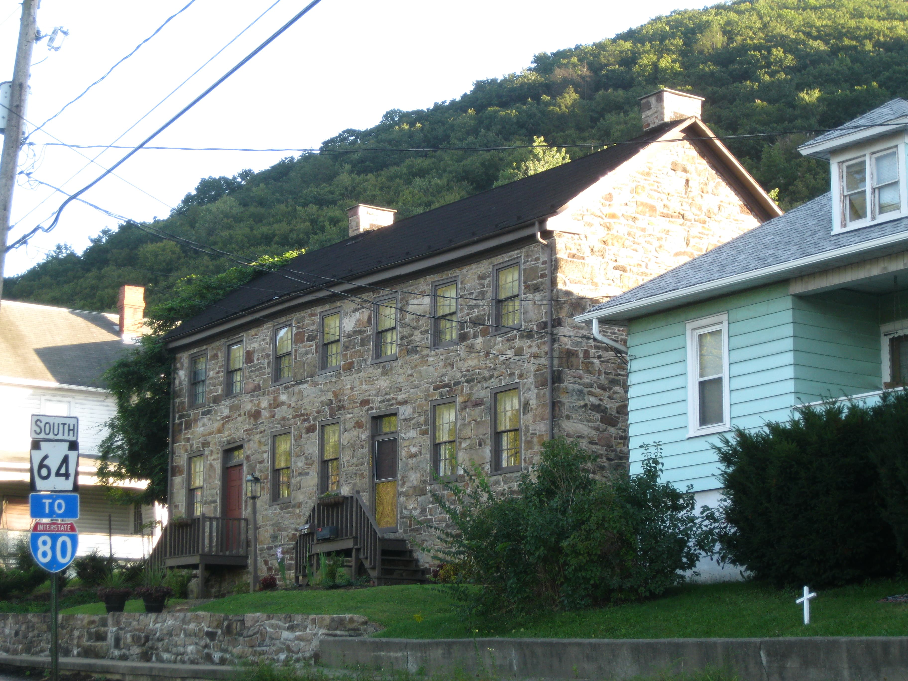 The historic Nathan Harvey House, a two-story early-1800s home in Mill Hall, Pennsylvania, listed on the National Register of Historic Places