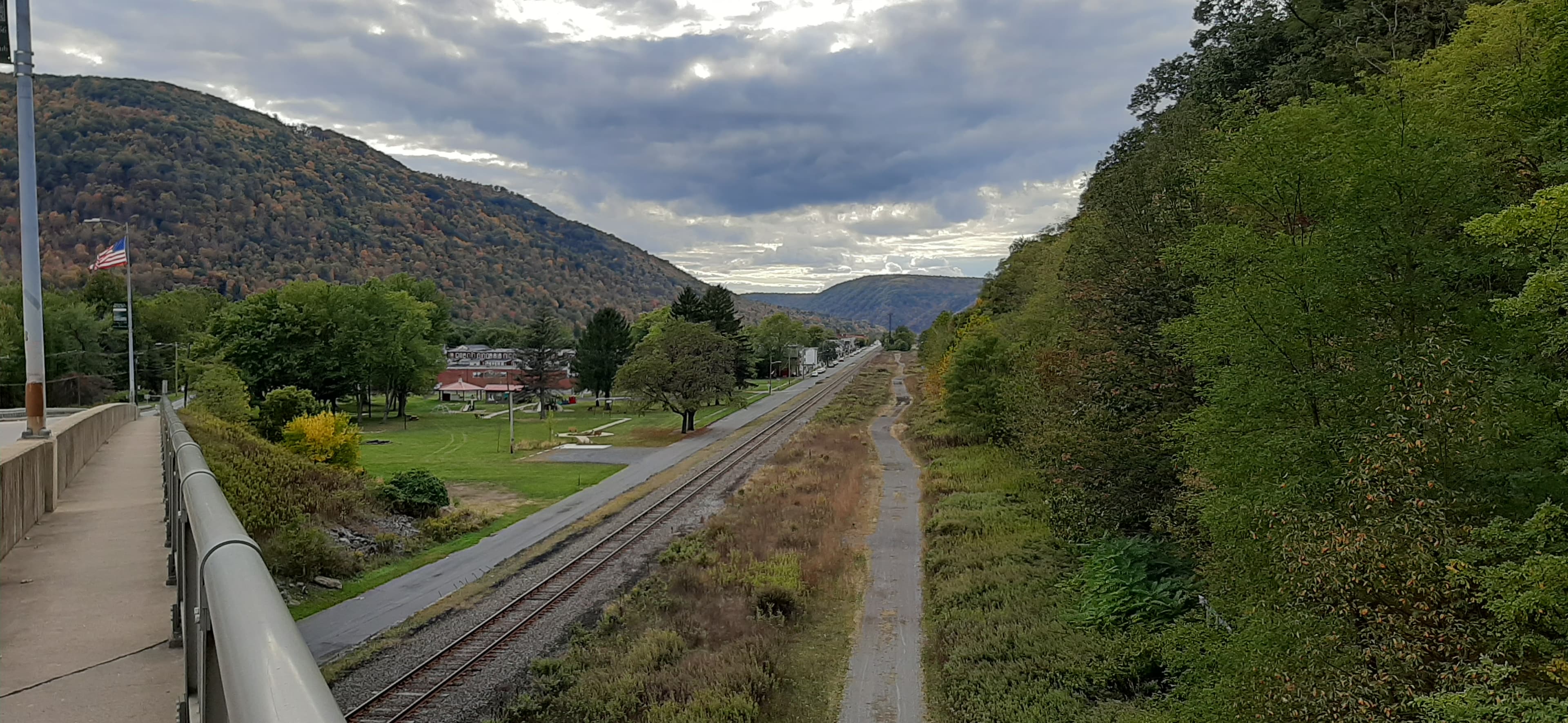 View of Renovo, Pennsylvania from Susquehanna Avenue, with a park and railroad tracks running through the small town near the West Branch Susquehanna River