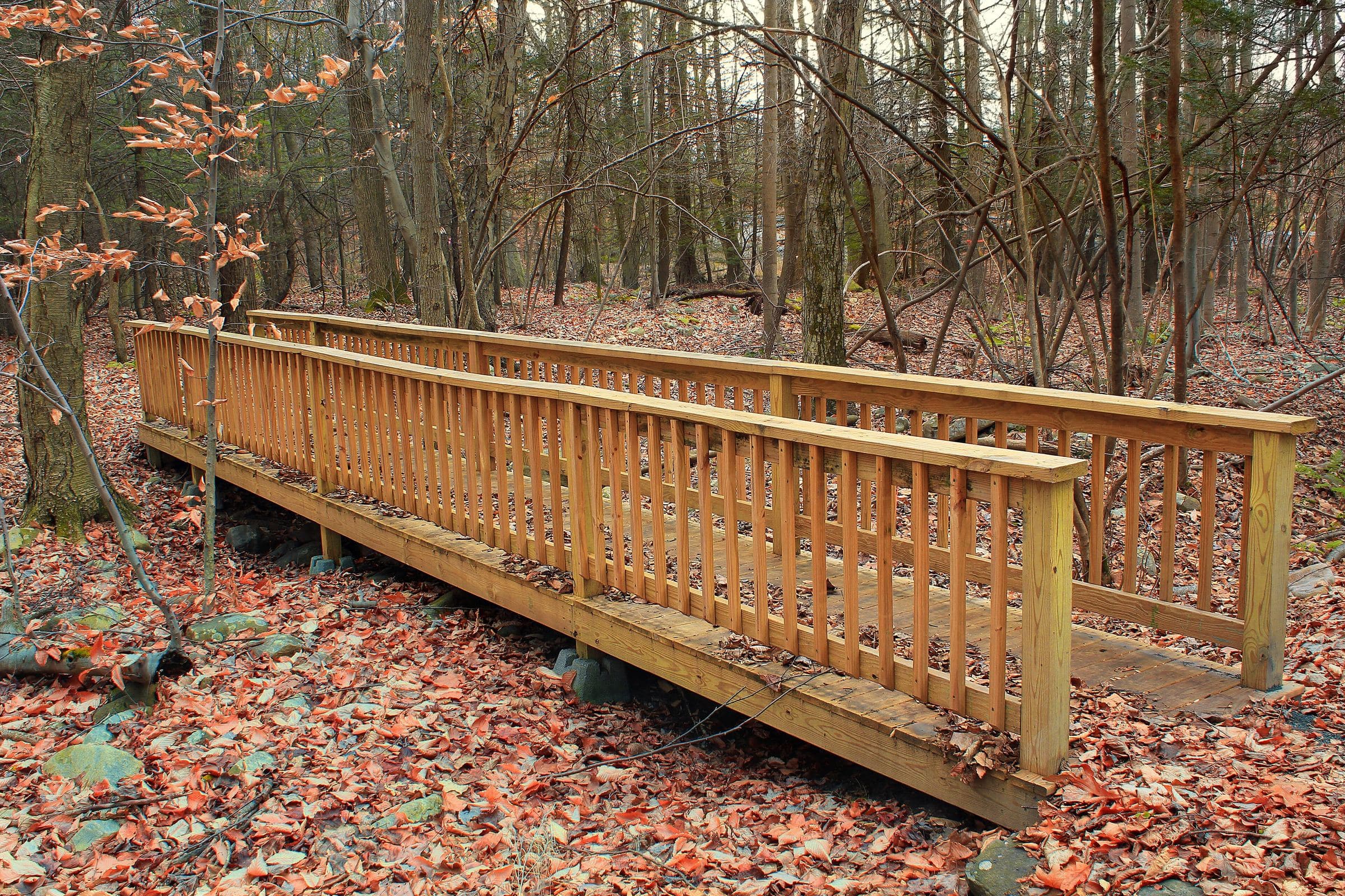 Wooden footbridge over a stream at Wayne Township Nature Park, near McElhattan in Clinton County, Pennsylvania